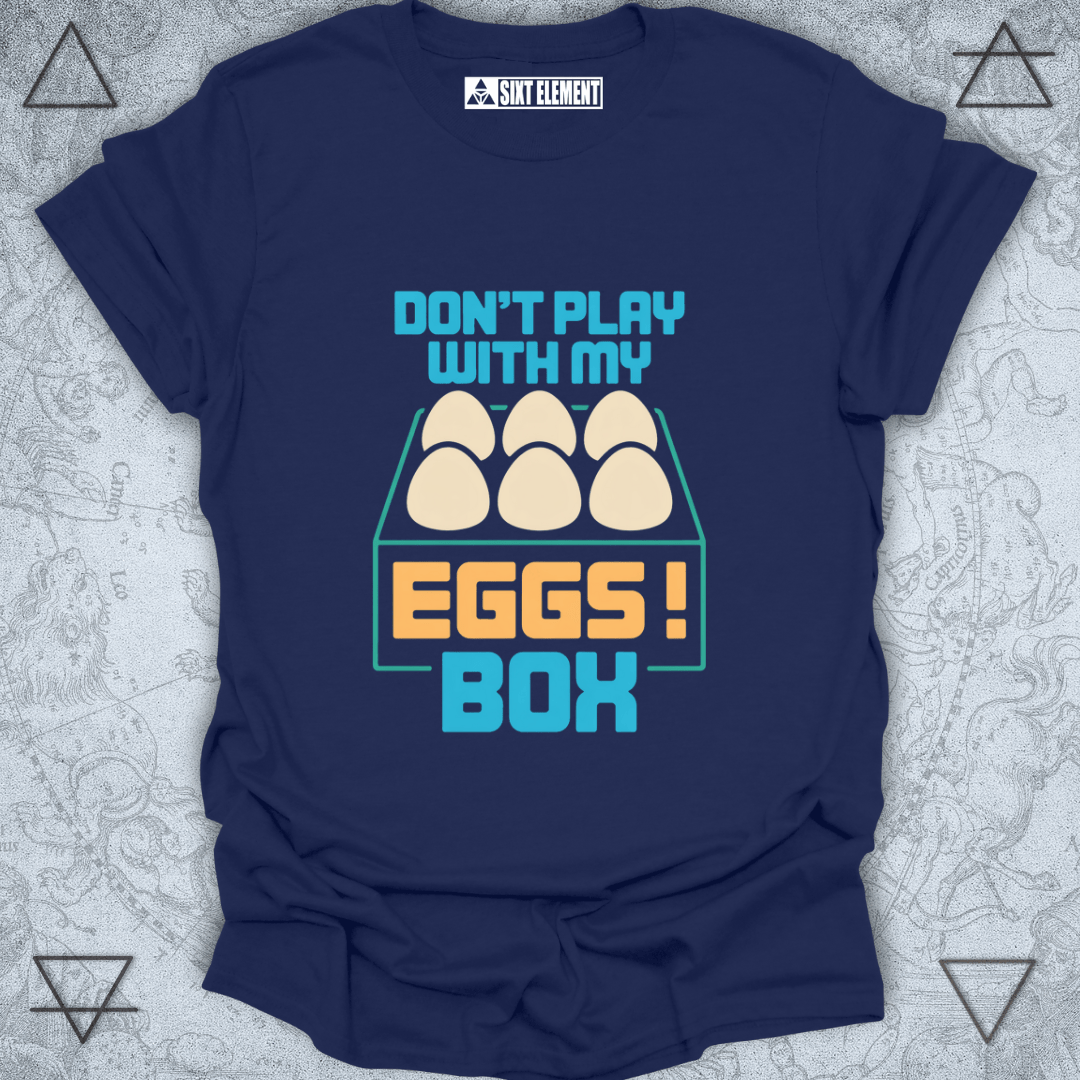 Navy blue t-shirt with 'Don't play with my eggs box' graphic on a textured gray background
FUNNY GAMERS T-SHIRT