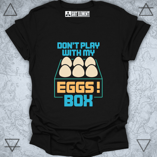 Black t-shirt with colorful graphic and text 'Don't play with my eggs box' on a textured background
FUNNY GAMERS T-SHIRT
