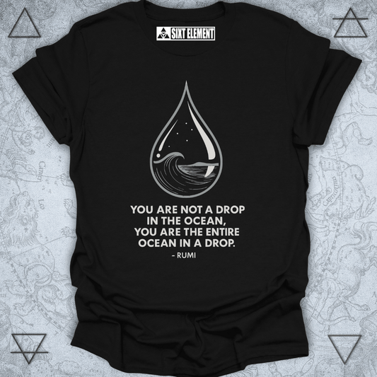 Minimalist black T-shirt design featuring a water droplet illustration containing an ocean wave, stars, and a moon. Below the artwork is the Rumi quote: “You are not a drop in the ocean, you are the entire ocean in a drop.” The design symbolizes unity, consciousness, and spiritual awareness.