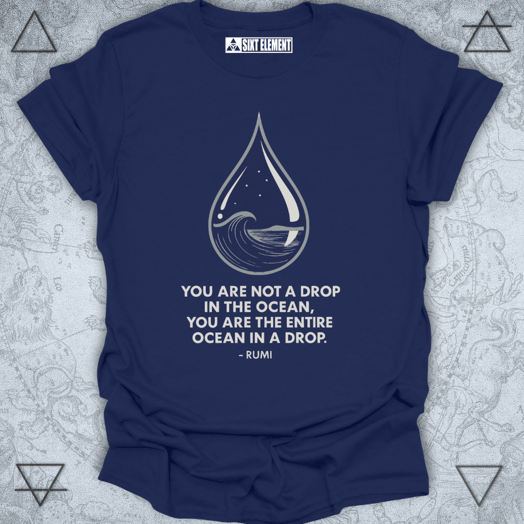 Minimalist black T-shirt design featuring a water droplet illustration containing an ocean wave, stars, and a moon. Below the artwork is the Rumi quote: “You are not a drop in the ocean, you are the entire ocean in a drop.” The design symbolizes unity, consciousness, and spiritual awareness.